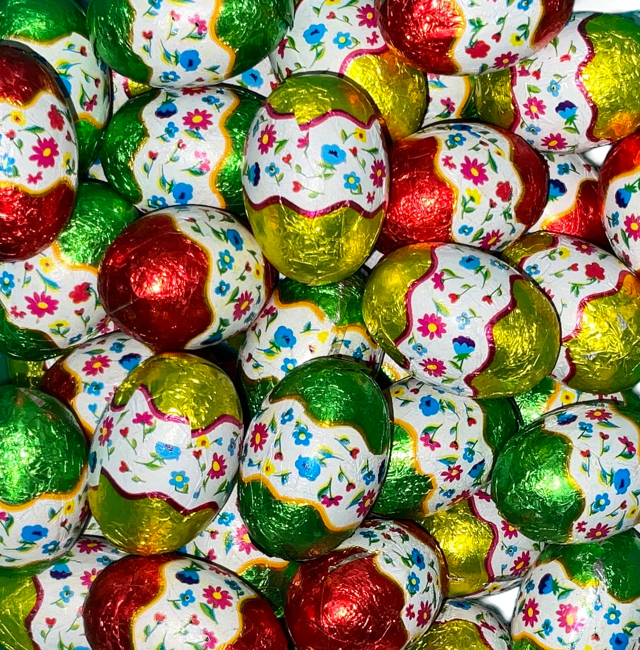 Ovetti 7 gr cioccolato al latte ripieni crema alla nocciola (incarto fiori) 1kg